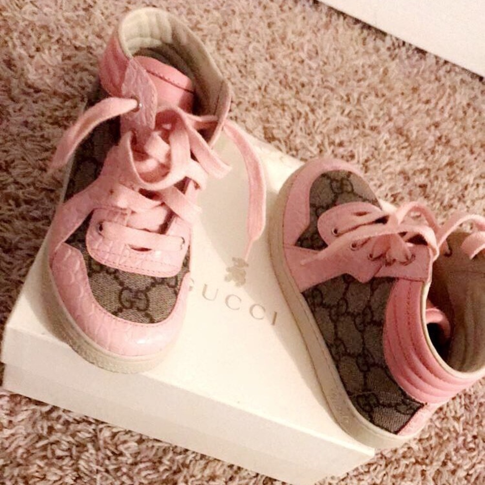 Children’s high top Gucci tennis shoes.